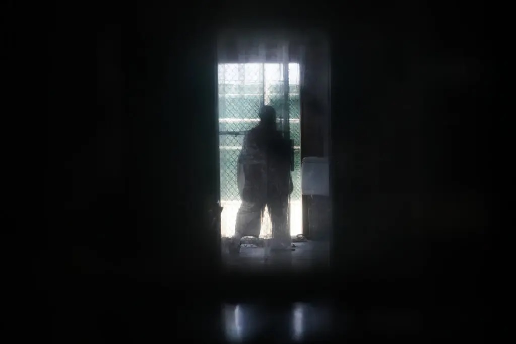 An inmate stands at the doorway to a recreation yard in 2019 at the main Guantnamo Bay prison complex, where prisoners from Camp 7 were moved after its closure. 